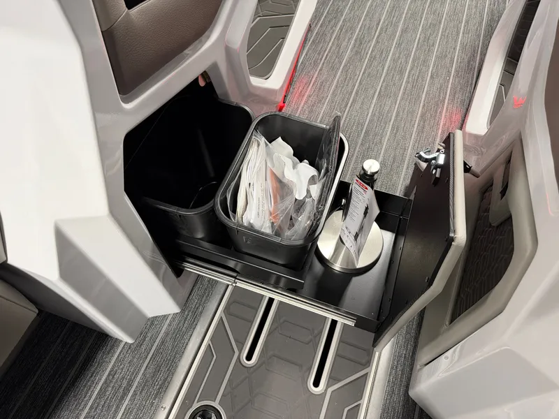 Slide: The Image of An open storage compartment with containers and accessories on a boat. - 40