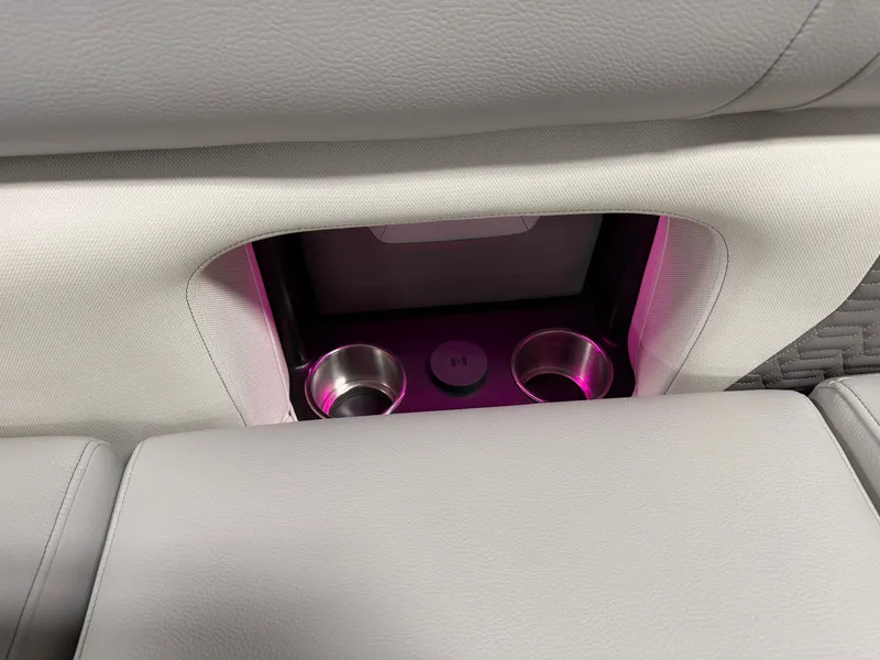 Slide: The Image of The 2027 Premier 250INTRIGUE features built-in cup holders with soft lighting. - 28