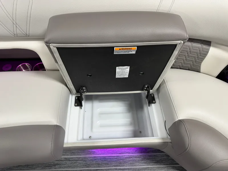 Slide: The Image of An open storage compartment in a boat with purple lighting underneath. - 29