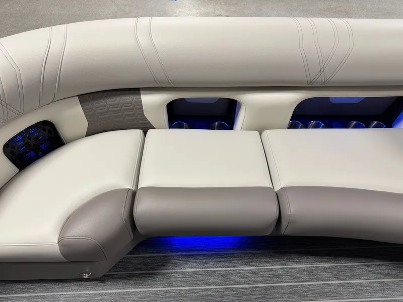 Slide: The Image of Luxurious upholstered seating with blue LED lighting and cup holders on a boat. - 15