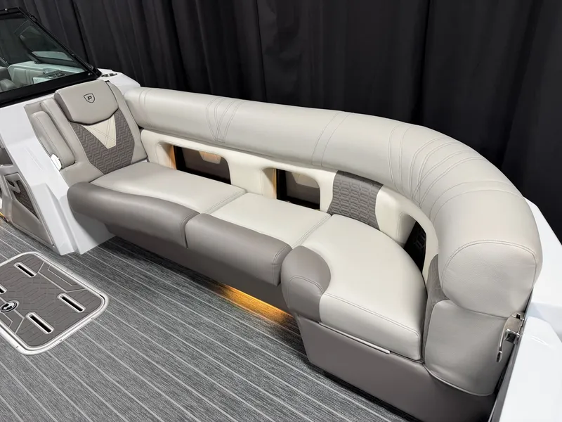 Slide: The Image of Luxurious, cushioned seating in a modern boat with gray carpeting and stylish design. - 23
