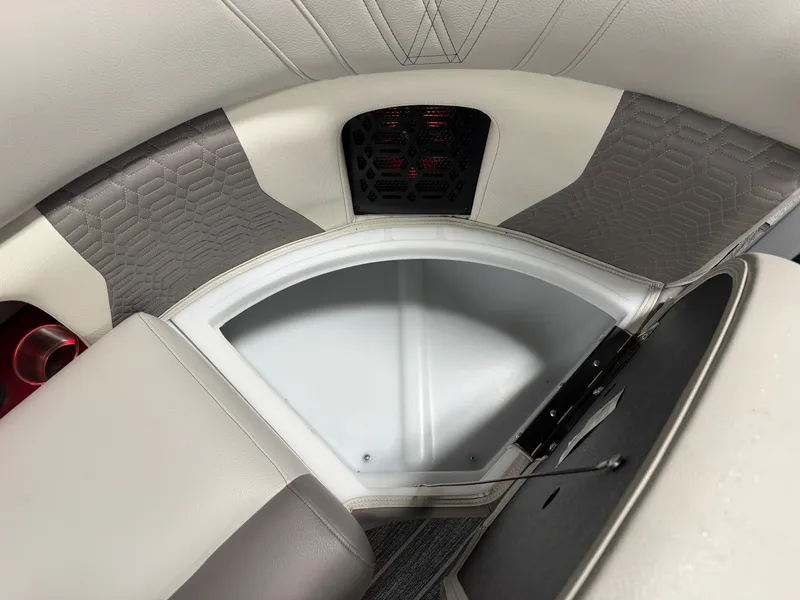 Slide: The Image of Close-up of a seating area with gray and white upholstery and a built-in speaker. - 26