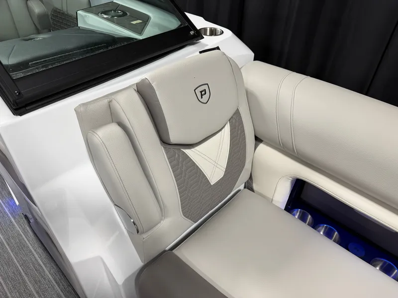 Slide: The Image of Luxurious seating area with gray and white upholstery, blue lighting, and cup holders. - 33