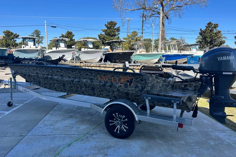 Slide: The Image of 2026 Excel 1751 Viper F4 boat with Yamaha motor on trailer, camo design. - 5