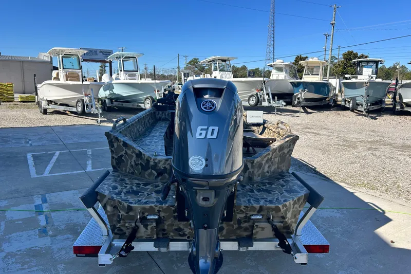 Slide: The Image of 2026 Excel 1751 Viper F4 boat with Yamaha 60 engine, parked outdoors. - 6