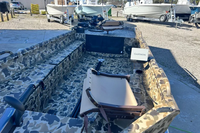 Slide: The Image of Camouflage-patterned 2026 Excel 1751 Viper F4 boat with Garmin equipment, docked outdoors. - 8