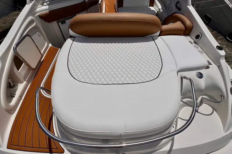 Slide: The Image of 2005 Monterey 298SS Super Sport boat interior with white and tan seating. - 10