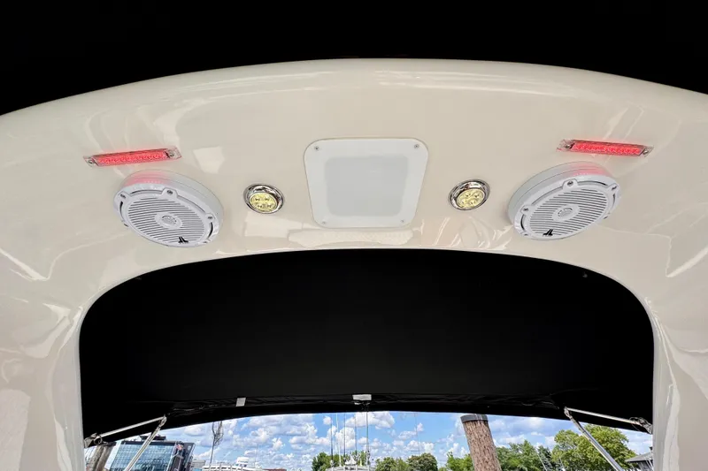 Slide: The Image of 2005 Monterey 298SS Super Sport boat speakers and lights on deck ceiling. - 18