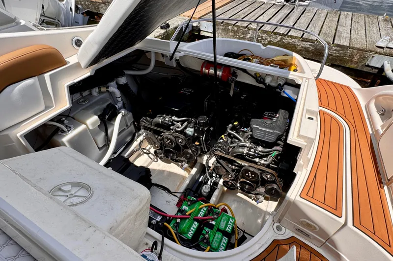 Slide: The Image of Open engine compartment of a 2005 Monterey 298SS Super Sport boat at a dock. - 22