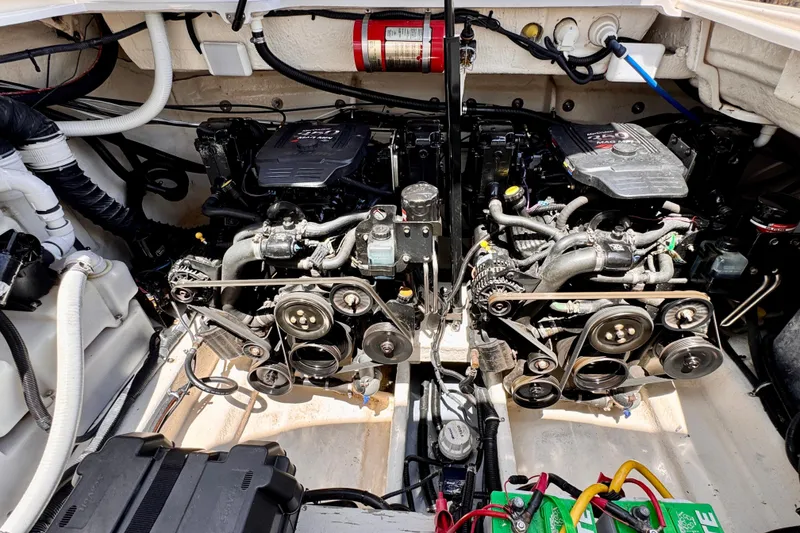 Slide: The Image of Engine compartment of a 2005 Monterey 298SS Super Sport boat, showcasing dual engines and components. - 23