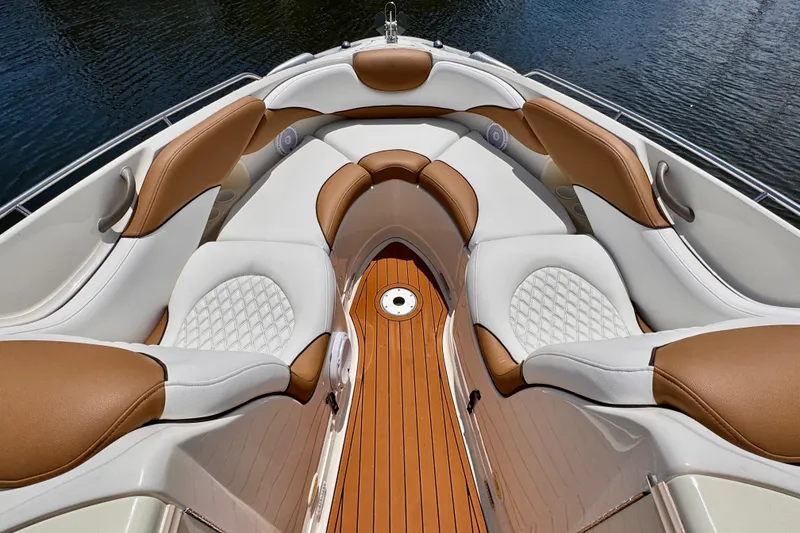 Slide: The Image of Luxurious seating on 2005 Monterey 298SS Super Sport boat, featuring elegant brown and white upholstery. - 7