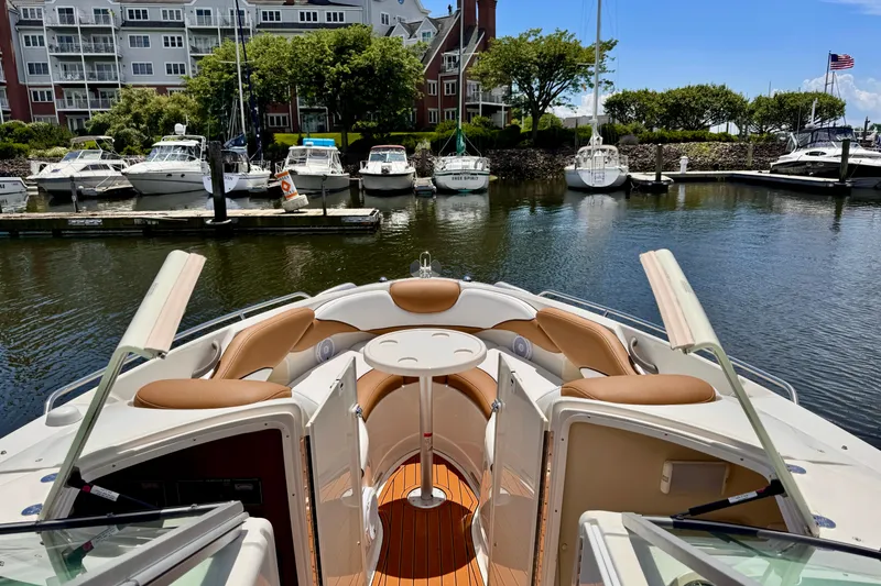 Slide: The Image of 2005 Monterey 298SS Super Sport boat docked in a scenic marina. - 8