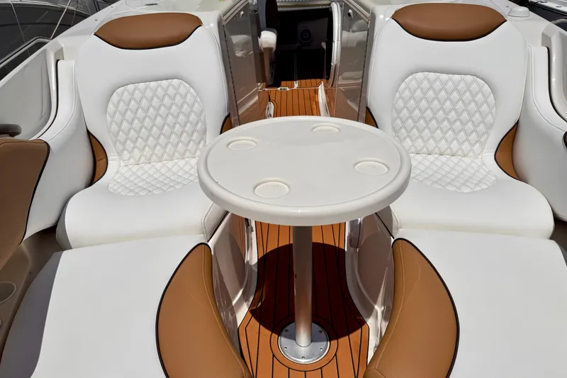 Slide: The Image of Luxurious seating on 2005 Monterey 298SS Super Sport boat with elegant white and tan upholstery. - 9