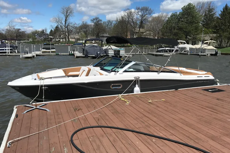 The Image of 2018 Four Winns H260 boat docked on a sunny day by the lake. - 0