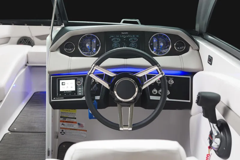 Slide: The Image of Manufacturer Provided Image: 2018 Four Winns H260 boat dashboard with modern controls and steering wheel. - 8