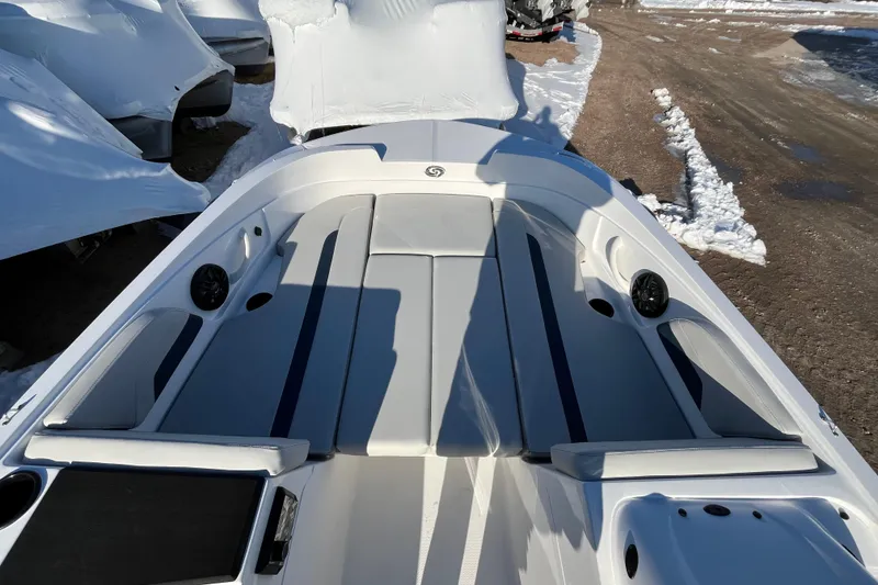 Slide: The Image of 2026 Hurricane SunDeck Sport 185 OB boat interior with cushioned seating and speakers. - 10