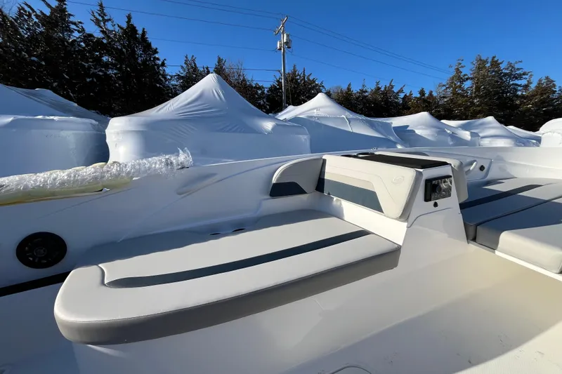 Slide: The Image of 2026 Hurricane SunDeck Sport 185 OB boat interior with sleek seating and modern design. - 14