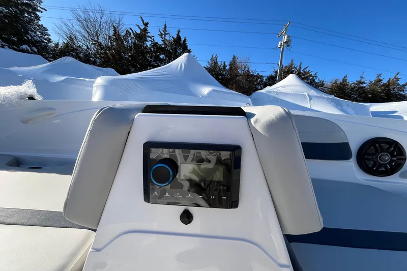 Slide: The Image of 2026 Hurricane SunDeck Sport 185 OB boat interior with control panel and speaker. - 17