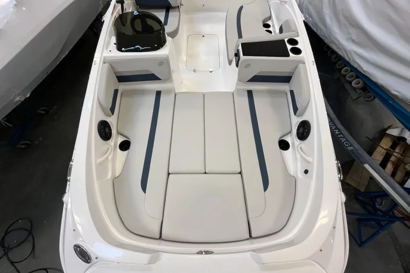 Slide: The Image of 2026 Hurricane SunDeck Sport 185 OB boat interior with white and blue seating. - 19