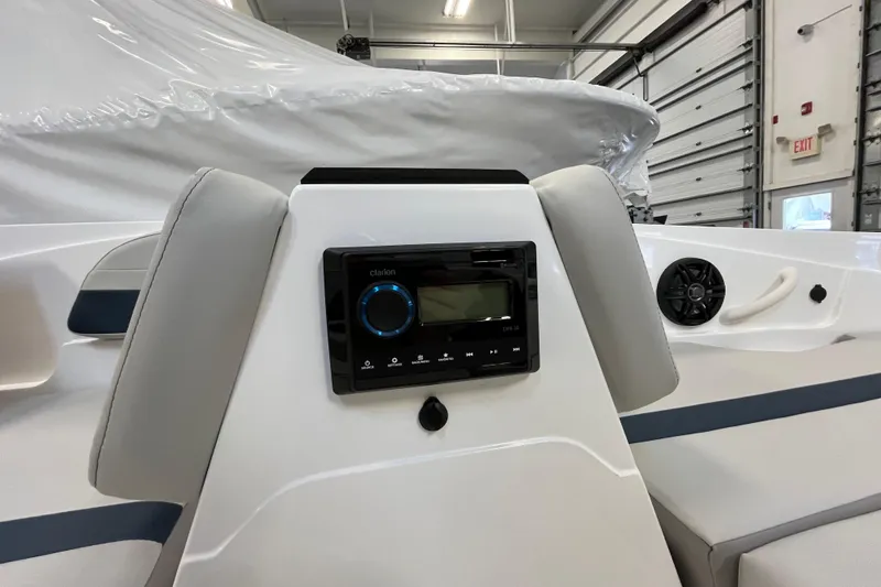 Slide: The Image of 2026 Hurricane SunDeck Sport 185 OB boat interior with audio system and seating. - 24