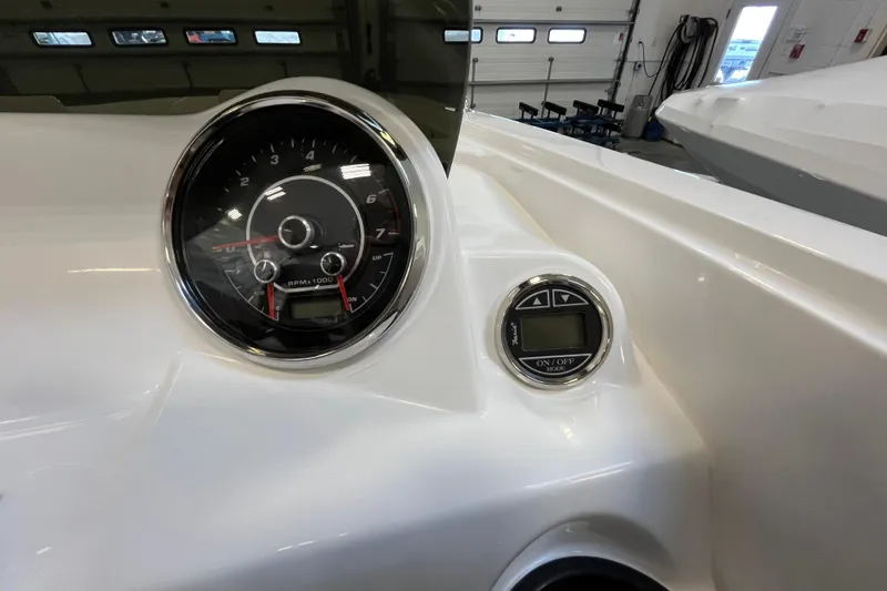 Slide: The Image of Dashboard of 2026 Hurricane SunDeck Sport 185 OB boat with tachometer and control panel. - 32