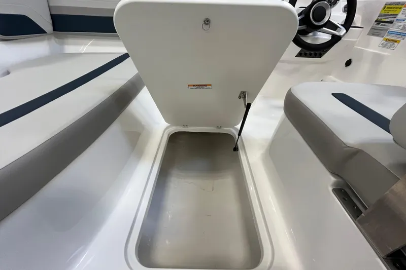 Slide: The Image of 2026 Hurricane SunDeck Sport 185 OB boat interior storage compartment and seating area. - 34