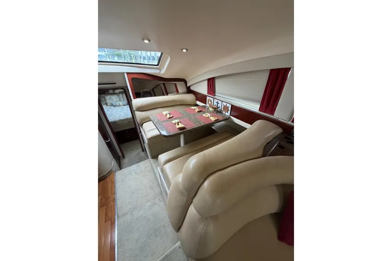 Slide: The Image of Luxurious interior of 2004 Sea Ray 480 Sedan Bridge yacht with elegant dining area. - 16