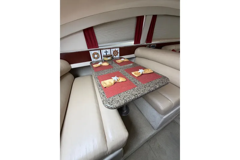 Slide: The Image of Luxurious dining area on 2004 Sea Ray 480 Sedan Bridge yacht with elegant table setting. - 22