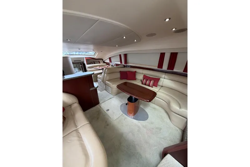 Slide: The Image of Luxurious interior of 2004 Sea Ray 480 Sedan Bridge with plush seating and elegant design. - 30
