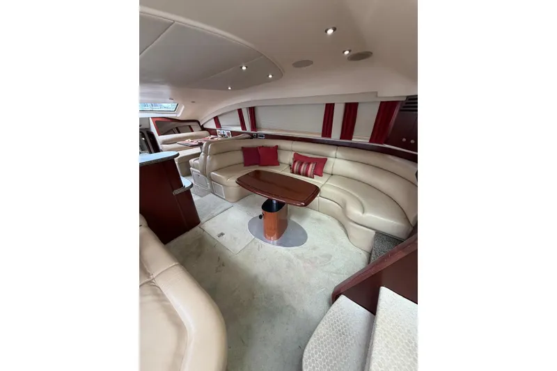 Slide: The Image of Luxurious interior of 2004 Sea Ray 480 Sedan Bridge with plush seating and elegant design. - 31