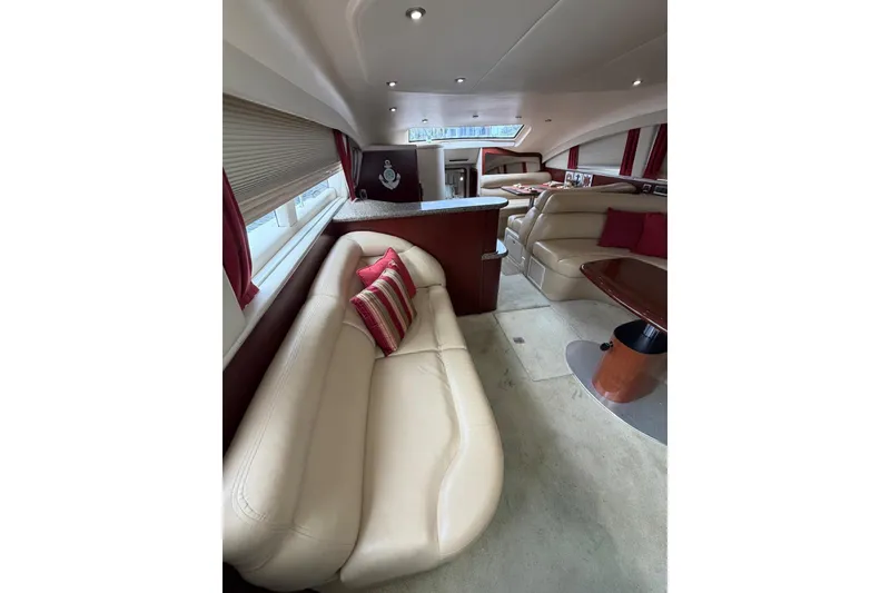 Slide: The Image of Luxurious interior of 2004 Sea Ray 480 Sedan Bridge yacht with plush seating and elegant decor. - 32