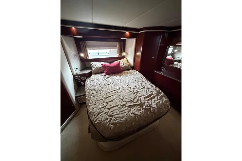 Slide: The Image of Luxurious bedroom interior of 2004 Sea Ray 480 Sedan Bridge yacht. - 38