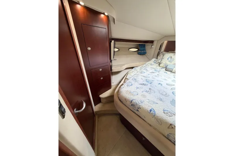 Slide: The Image of Luxurious 2004 Sea Ray 480 Sedan Bridge cabin interior with elegant wood finishes. - 49