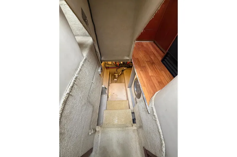 Slide: The Image of Interior view of 2004 Sea Ray 480 Sedan Bridge, showing stairs and hallway. - 55