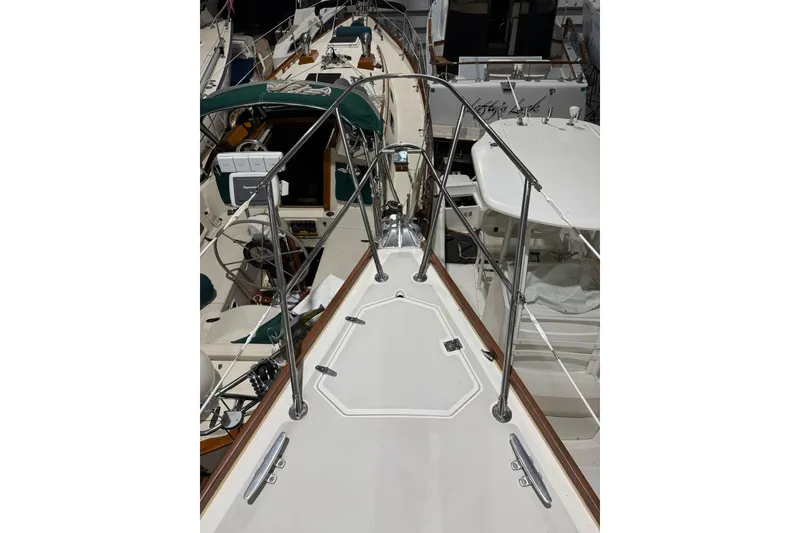 Slide: The Image of 1986 Sabre 34 MK II sailboat deck with stainless steel railings and cockpit view. - 14