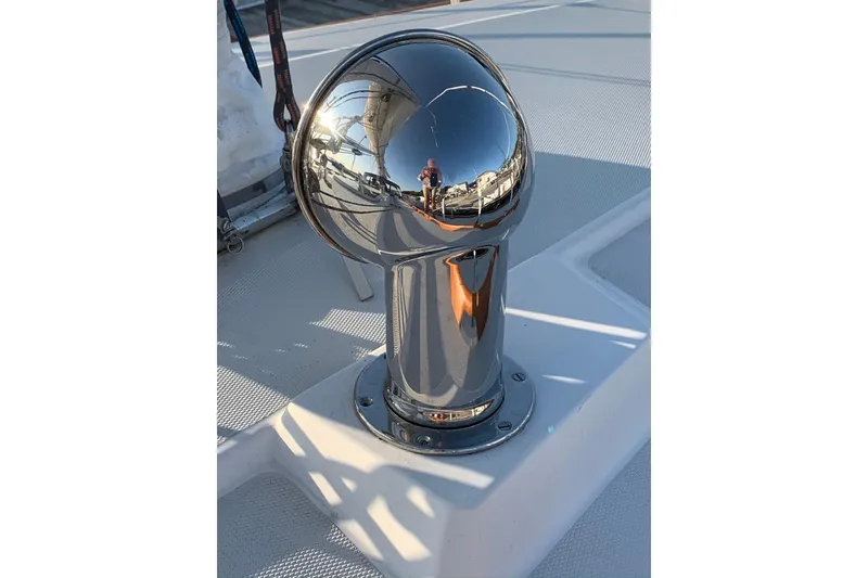 Slide: The Image of Chrome vent on 1986 Sabre 34 MK II sailboat deck, reflecting surroundings. - 24