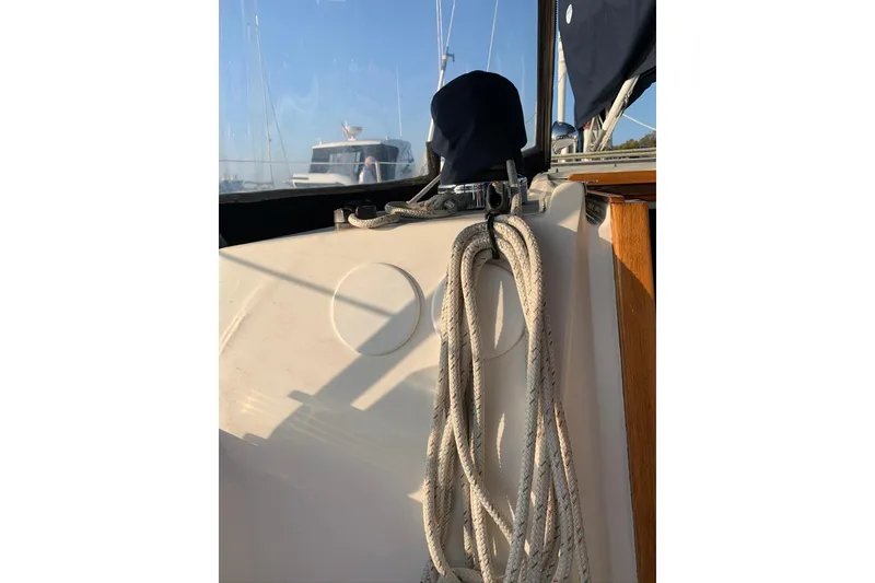 Slide: The Image of 1986 Sabre 34 MK II sailboat cockpit with coiled rope and winch. - 25