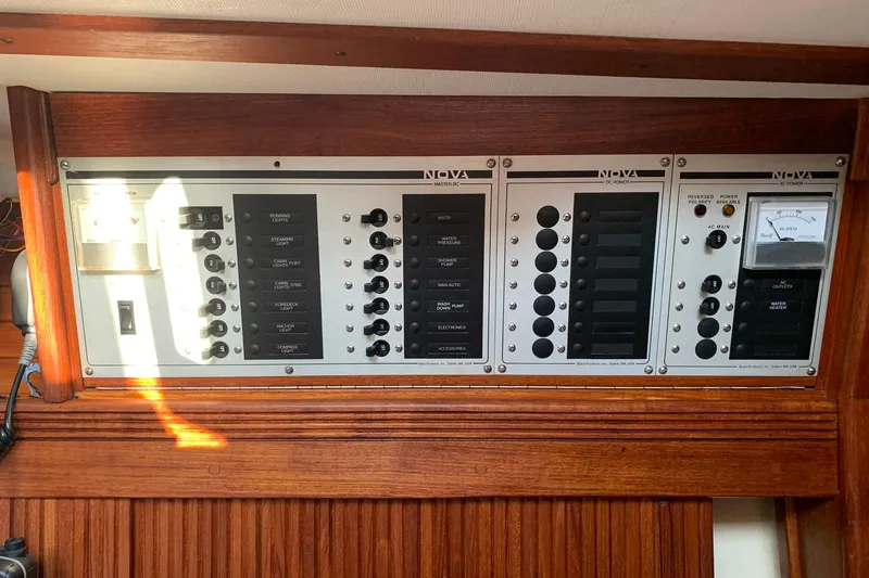 Slide: The Image of Electrical control panel on a 1986 Sabre 34 MK II sailboat, featuring switches and gauges. - 37