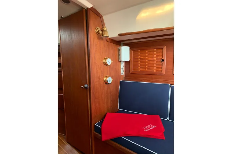Slide: The Image of Interior of 1986 Sabre 34 MK II sailboat with wood paneling and blue seating. - 41
