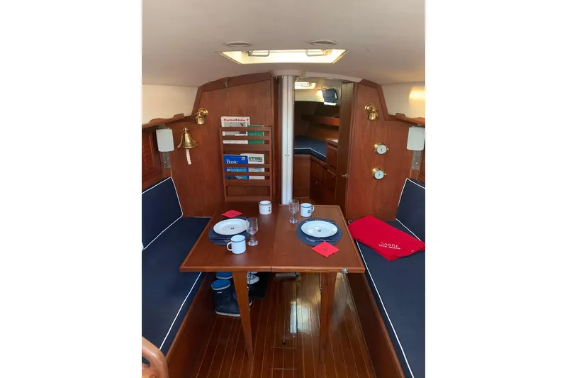 Slide: The Image of Interior of 1986 Sabre 34 MK II sailboat with dining table and seating area. - 43