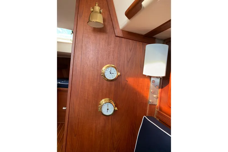Slide: The Image of Interior of 1986 Sabre 34 MK II yacht with wooden panel, brass clock, and barometer. - 45