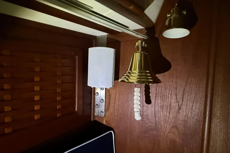 Slide: The Image of Brass bell and light fixture on 1986 Sabre 34 MK II wooden interior. - 46
