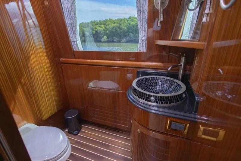 Slide: The Image of Luxurious interior of 2009 Hargrave Enclosed Bridge yacht with elegant wood finishes and ocean view. - 13