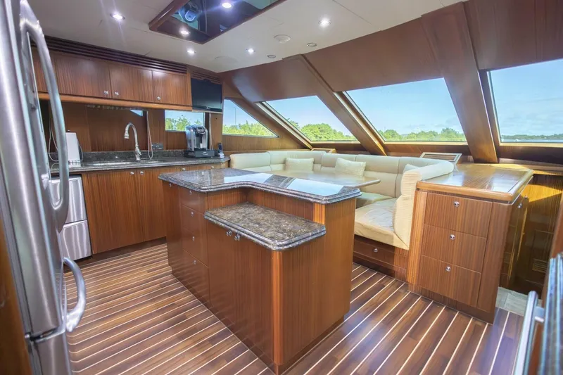 Slide: The Image of Luxurious 2009 Hargrave Enclosed Bridge yacht interior with elegant wood finishes and staircase. - 14