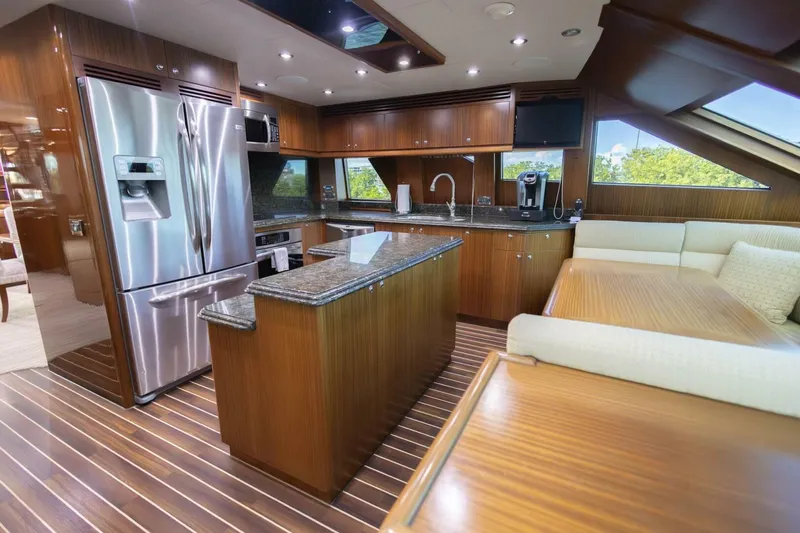 Slide: The Image of Luxurious 2009 Hargrave Enclosed Bridge yacht interior with elegant wood finishes and ocean view. - 15