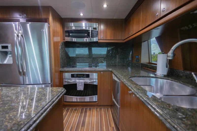 Slide: The Image of Luxurious 2009 Hargrave Enclosed Bridge yacht interior with modern kitchen and seating area. - 19