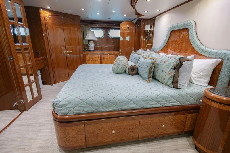 Slide: The Image of Luxurious 2009 Hargrave Enclosed Bridge yacht interior with red captain chairs and control panel. - 27