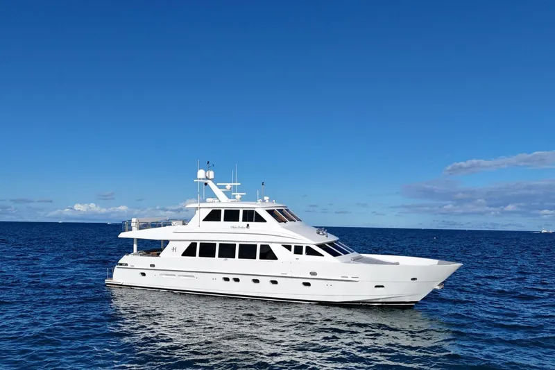 Slide: The Image of 2009 Hargrave Enclosed Bridge yacht cruising on blue ocean near city skyline. - 3