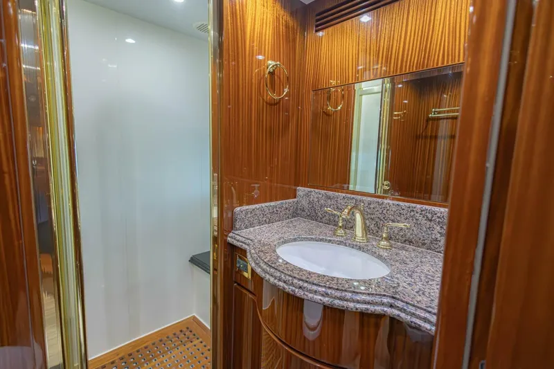 Slide: The Image of Luxurious bathroom in 2009 Hargrave Enclosed Bridge yacht with dual sinks and elegant wood paneling. - 38
