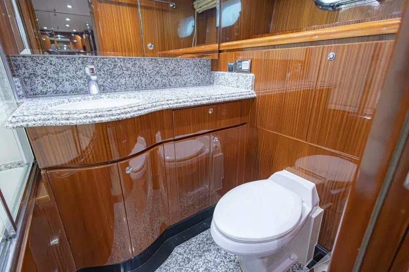 Slide: The Image of Luxurious 2009 Hargrave Enclosed Bridge yacht bedroom with wood paneling and porthole window. - 46